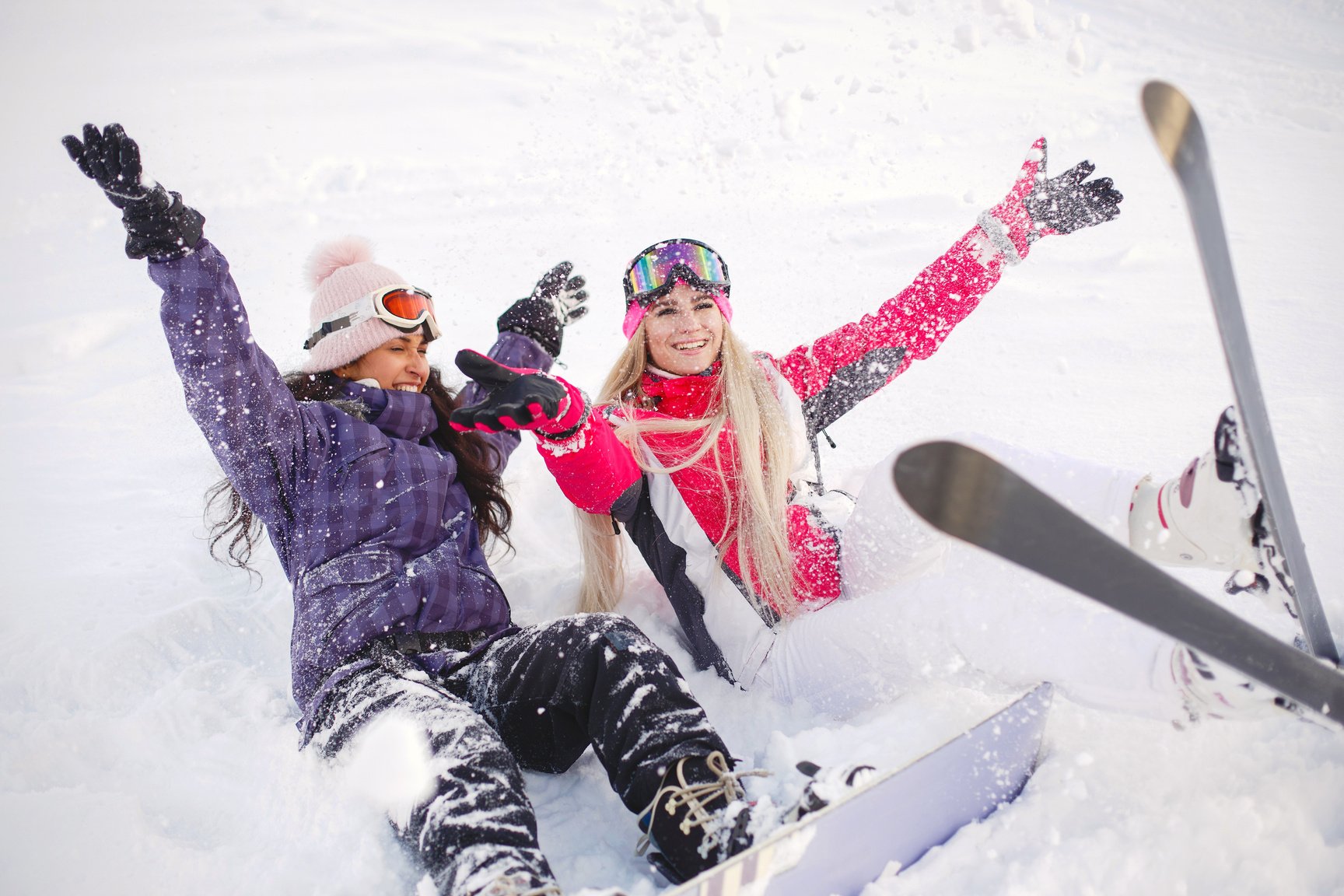 Women Enjoying Ski Boards in Snow